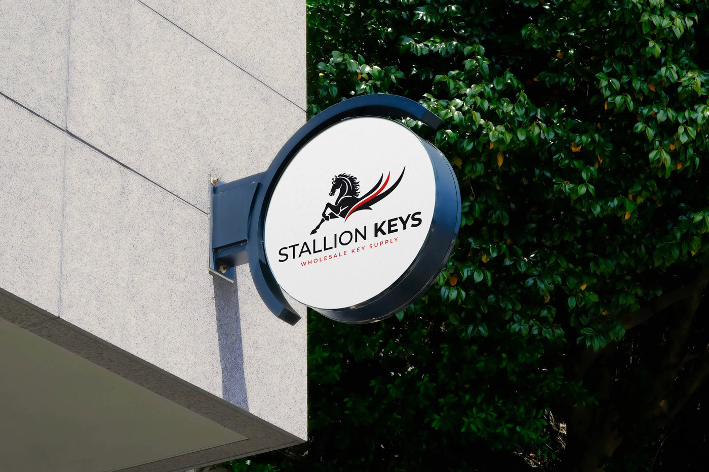 Stallion Keys wholesale key supply storefront sign featuring the company logo mounted on a modern commercial building exterior.